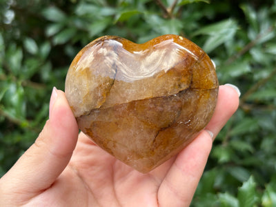Natural polished heart-shaped Golden Healer Quartz crystal gemstone, ideal for meditation, energy healing and elegant home decor - RSH319